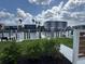 Scenic waterfront view featuring docks, lush greenery, and residential buildings on a sunny day at 1617 Sea Haven Dr # 502, Punta Gorda, FL 33950