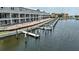 Waterfront view of condos under construction, featuring private boat docks and canal access at 1617 Sea Haven Dr # 502, Punta Gorda, FL 33950