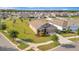 Expansive aerial view of the property showcasing its large lot, proximity to neighborhood, and well-maintained lawn at 16341 Little Garden Dr, Wimauma, FL 33598
