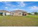 A spacious backyard with patio furniture perfect for outdoor living and entertaining at 16341 Little Garden Dr, Wimauma, FL 33598