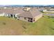 Aerial view of the backyard and covered patio at 16341 Little Garden Dr, Wimauma, FL 33598