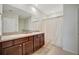 Bathroom with a double sink vanity, ample counter space and recessed lighting at 16341 Little Garden Dr, Wimauma, FL 33598