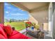 Relaxing outdoor patio with stylish furniture and views of the lush backyard at 16341 Little Garden Dr, Wimauma, FL 33598