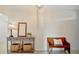 The entryway has a wood table, lamp and bench at 16341 Little Garden Dr, Wimauma, FL 33598