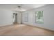 Bright bedroom featuring neutral carpet and a view to the outside at 1704 4Th W St, Palmetto, FL 34221