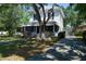 Two-story home with a charming screened porch, landscaped yard, and inviting curb appeal at 1704 4Th W St, Palmetto, FL 34221