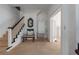 Hallway featuring neutral carpet, white walls, table and mirror at 1704 4Th W St, Palmetto, FL 34221
