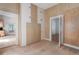 Wood-paneled hallway featuring cabinets and doorway at 1704 4Th W St, Palmetto, FL 34221