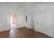 Open-concept living room with hardwood floors and multiple doorways at 1704 4Th W St, Palmetto, FL 34221