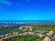Panoramic aerial shot highlighting a beautiful coastal community with stunning waterfront and skyline views at 1712 Starling Dr # 101, Sarasota, FL 34231
