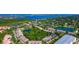 Stunning aerial view of a lush community featuring ponds, landscaping, and attractive architecture at 1712 Starling Dr # 101, Sarasota, FL 34231