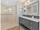 Stylish bathroom with tile shower, modern vanity, and decorative accents at 1712 Starling Dr # 101, Sarasota, FL 34231