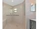 Wheelchair accessible tiled shower with grab bars, bench, and a window at 1712 Starling Dr # 101, Sarasota, FL 34231