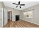 Bedroom with a ceiling fan, window, closet, and wood-look tile at 1712 Starling Dr # 101, Sarasota, FL 34231