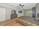 Inviting bedroom featuring a ceiling fan, television, and wood-look tile at 1712 Starling Dr # 101, Sarasota, FL 34231