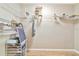 Walk-in closet with custom shelving and ample storage space at 1712 Starling Dr # 101, Sarasota, FL 34231