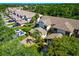 Beautiful townhome with lush landscaping, a two-car garage, and a brick driveway in a well-maintained community at 1712 Starling Dr # 101, Sarasota, FL 34231