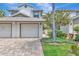 Charming townhouse featuring a two-car garage and well-manicured landscaping at 1712 Starling Dr # 101, Sarasota, FL 34231