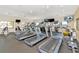 Well-equipped fitness center featuring treadmills, elliptical machines, and wall-mounted TVs at 1712 Starling Dr # 101, Sarasota, FL 34231