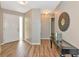 Welcoming foyer featuring wood-look tile, stylish decor, and a bright, airy atmosphere at 1712 Starling Dr # 101, Sarasota, FL 34231