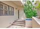 Inviting front entrance with a decorative plant, steps, and brick entryway to welcome you home at 1712 Starling Dr # 101, Sarasota, FL 34231