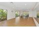 Bright game room featuring a ping pong table, with large windows providing natural light and views at 1712 Starling Dr # 101, Sarasota, FL 34231
