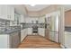 Modern kitchen boasts stainless steel appliances, sleek countertops, and stylish backsplash at 1712 Starling Dr # 101, Sarasota, FL 34231