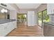 Open floor plan with a view from the kitchen to the dining area and a large sliding glass door at 1712 Starling Dr # 101, Sarasota, FL 34231