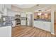 Bright kitchen featuring stainless steel appliances, white cabinetry, and an open layout at 1712 Starling Dr # 101, Sarasota, FL 34231