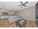 Comfortable living room showcasing modern furnishings, stylish lighting, and wood-look tile flooring at 1712 Starling Dr # 101, Sarasota, FL 34231
