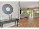Open-concept living room with wood-look tile flooring and neutral tones for a modern aesthetic at 1712 Starling Dr # 101, Sarasota, FL 34231