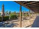 Inviting outdoor patio area with brick pavers, featuring comfortable seating and lush landscaping at 1712 Starling Dr # 101, Sarasota, FL 34231