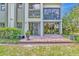 Relaxing brick patio provides a serene outdoor living space with lush landscaping at 1712 Starling Dr # 101, Sarasota, FL 34231