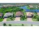 Aerial view showcasing a beautiful single-Gathering home near a scenic lake and lush green surroundings at 17820 Waterville Pl, Lakewood Ranch, FL 34202