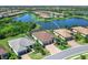 Aerial view showcasing a beautiful single-Gathering home near a scenic lake and lush green surroundings at 17820 Waterville Pl, Lakewood Ranch, FL 34202