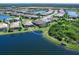 Picturesque aerial shot of a home nestled by a tranquil lake in a well-designed community at 17820 Waterville Pl, Lakewood Ranch, FL 34202