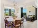 Bright dining room featuring backyard views and stylish pendant lighting at 17820 Waterville Pl, Lakewood Ranch, FL 34202