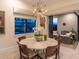 Bright dining room featuring backyard views and stylish pendant lighting at 17820 Waterville Pl, Lakewood Ranch, FL 34202