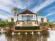 A beautiful Del Webb Lakewood Ranch entrance sign surrounded by a pond and lush landscaping at 17820 Waterville Pl, Lakewood Ranch, FL 34202