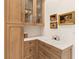 Kitchenette with custom cabinets, drawers, and marble countertops at 17820 Waterville Pl, Lakewood Ranch, FL 34202