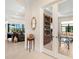 Open living space featuring decorative shelving and ample seating at 17820 Waterville Pl, Lakewood Ranch, FL 34202