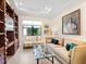 Comfortable living room features stylish decor, plenty of natural light, and modern shelving at 17820 Waterville Pl, Lakewood Ranch, FL 34202