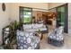 Inviting covered patio featuring stylish seating, views of the interior, and lush greenery for relaxation and entertaining at 17820 Waterville Pl, Lakewood Ranch, FL 34202