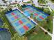 Aerial view of multiple pickleball courts in a beautifully landscaped community at 17820 Waterville Pl, Lakewood Ranch, FL 34202