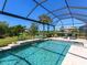 Gorgeous screened-in pool area with sparkling water, a tropical landscape, and serene views of the surrounding greenery at 17820 Waterville Pl, Lakewood Ranch, FL 34202