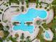 A resort-style pool with lounge chairs and palm trees, perfect for relaxing and enjoying the outdoors at 17820 Waterville Pl, Lakewood Ranch, FL 34202