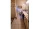 Functional bathroom with a dual-sink vanity, tile flooring, and a shower, providing essential amenities at 1810 Rudder Dr, Valrico, FL 33594