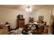 Cozy bedroom featuring a ceiling fan, corner windows, and a mix of furnishings, offering a comfortable retreat at 1810 Rudder Dr, Valrico, FL 33594
