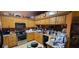 Traditional kitchen equipped with wood cabinetry, appliances, and ample counter space for cooking and storage at 1810 Rudder Dr, Valrico, FL 33594