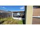 Enclosed patio with screens, providing a space for outdoor living and enjoying the surrounding backyard at 1810 Rudder Dr, Valrico, FL 33594